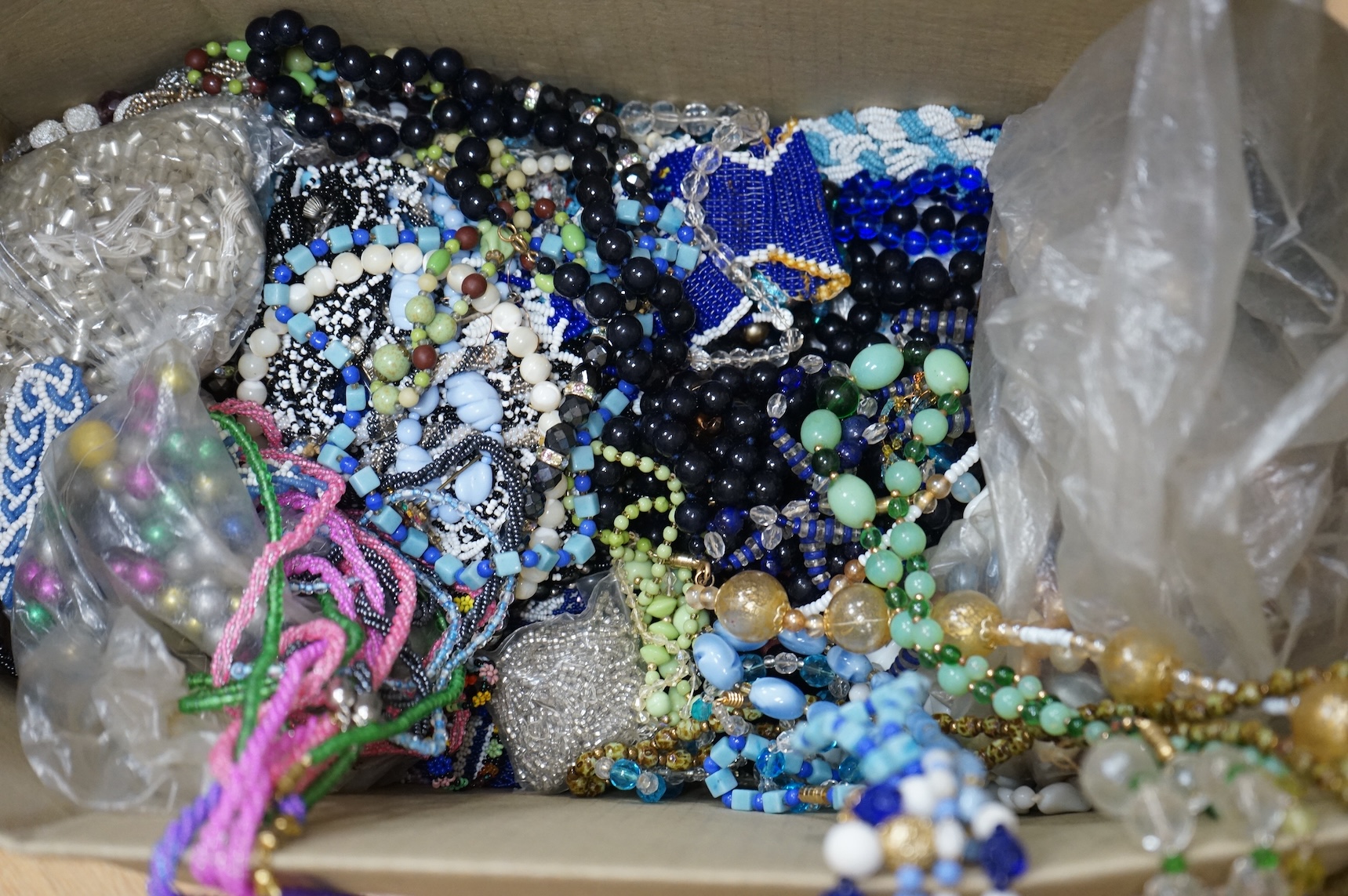 A large collection of glass bead necklaces